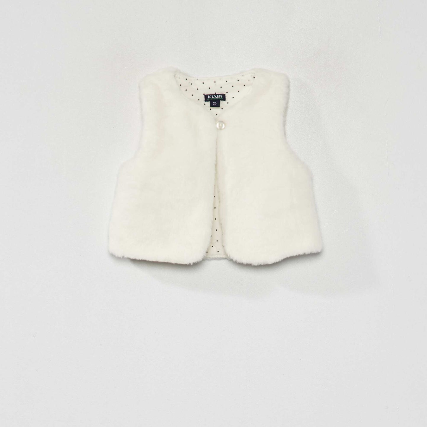 Sleeveless faux fur jacket White