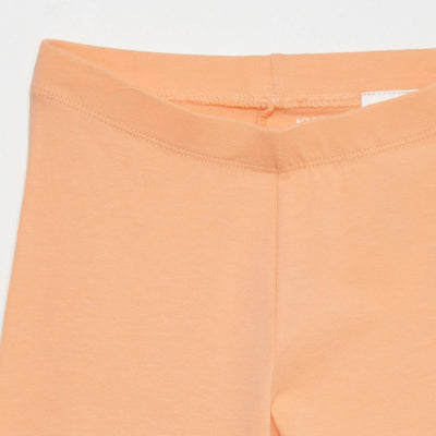 بنطال مطاطي بطول 3/4 تحت الركبة باللون البرتقالي