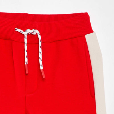 سويت شيرت من قماش متعدد الألوان، بنطلون رياضي باللون الأحمر