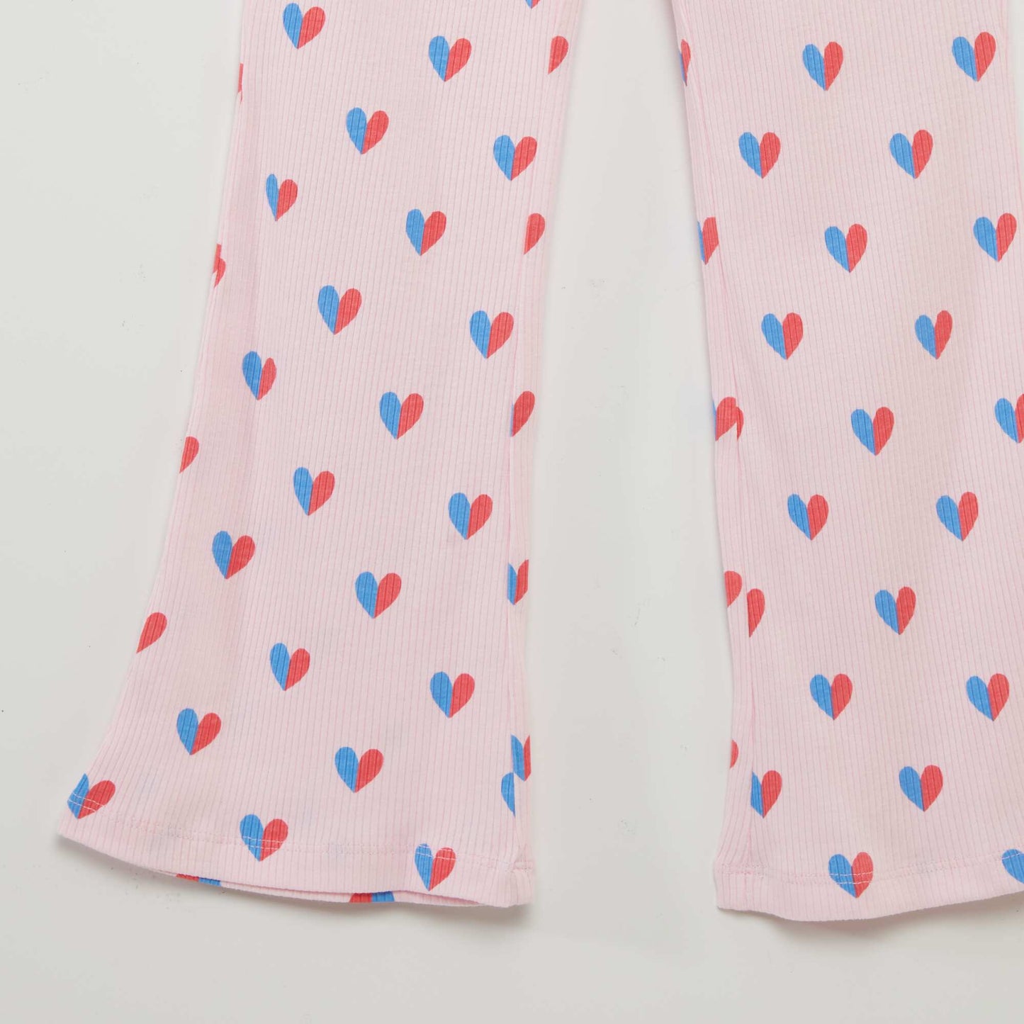 Flared trousers with heart print WHITE