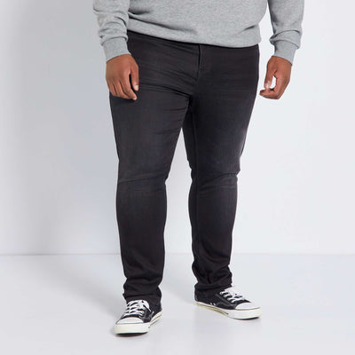 بنطلون جينز ضيق مطاطي باللون الأسود